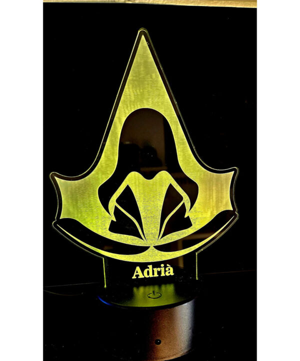 Lámpara decorativa en metacrilato con luz de LED que representa el logo de la Hermandad de Asesinos