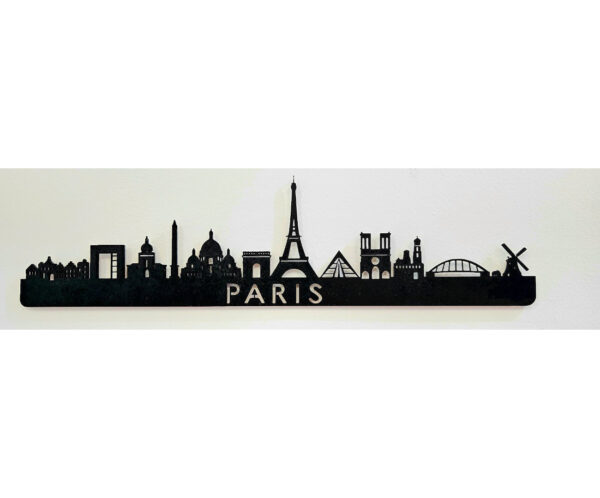 silueta en madera negra de varios monumentos representativos de París.